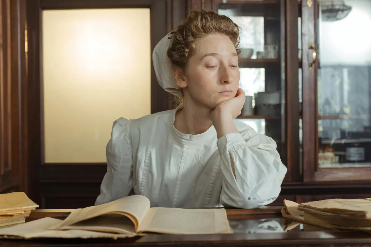 An author at work in a quiet study at evening